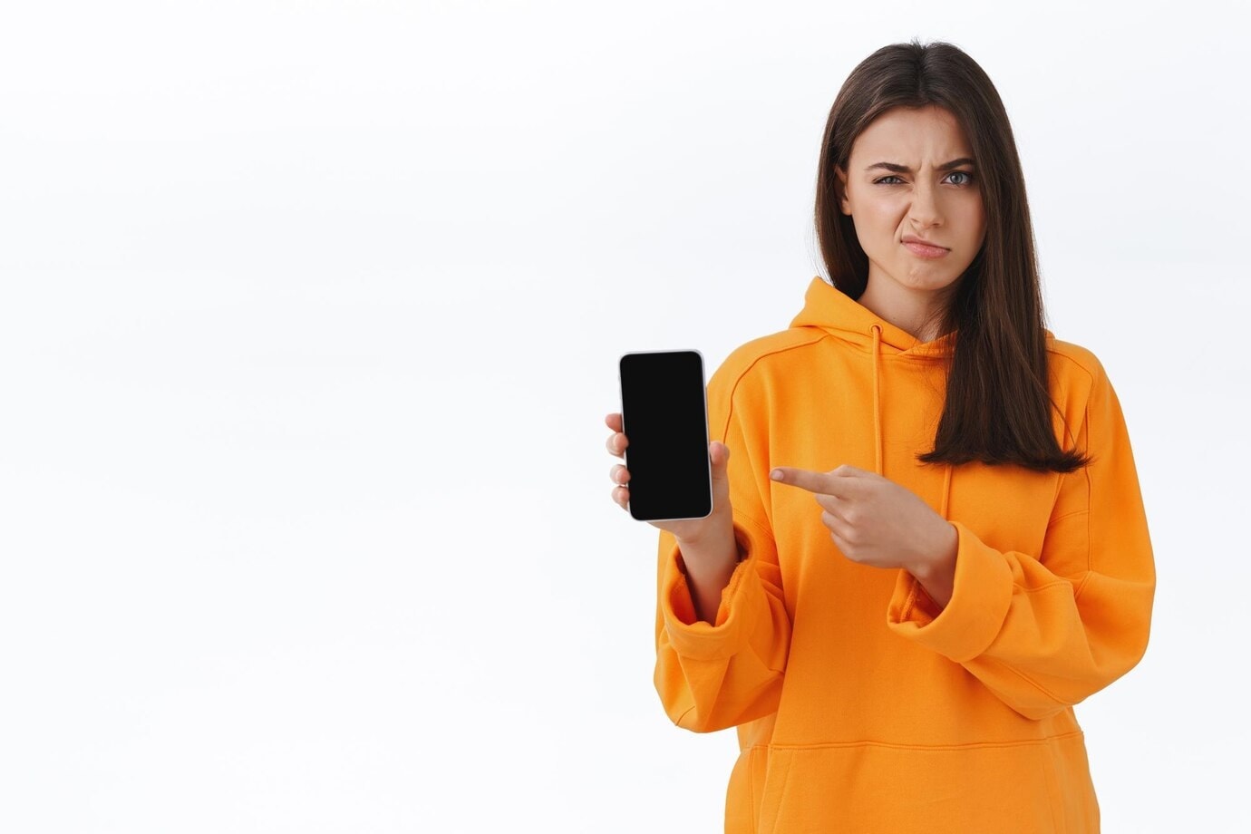 girl pointing at phone with problem