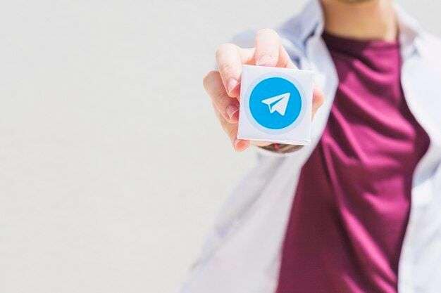 man holding telegram logo