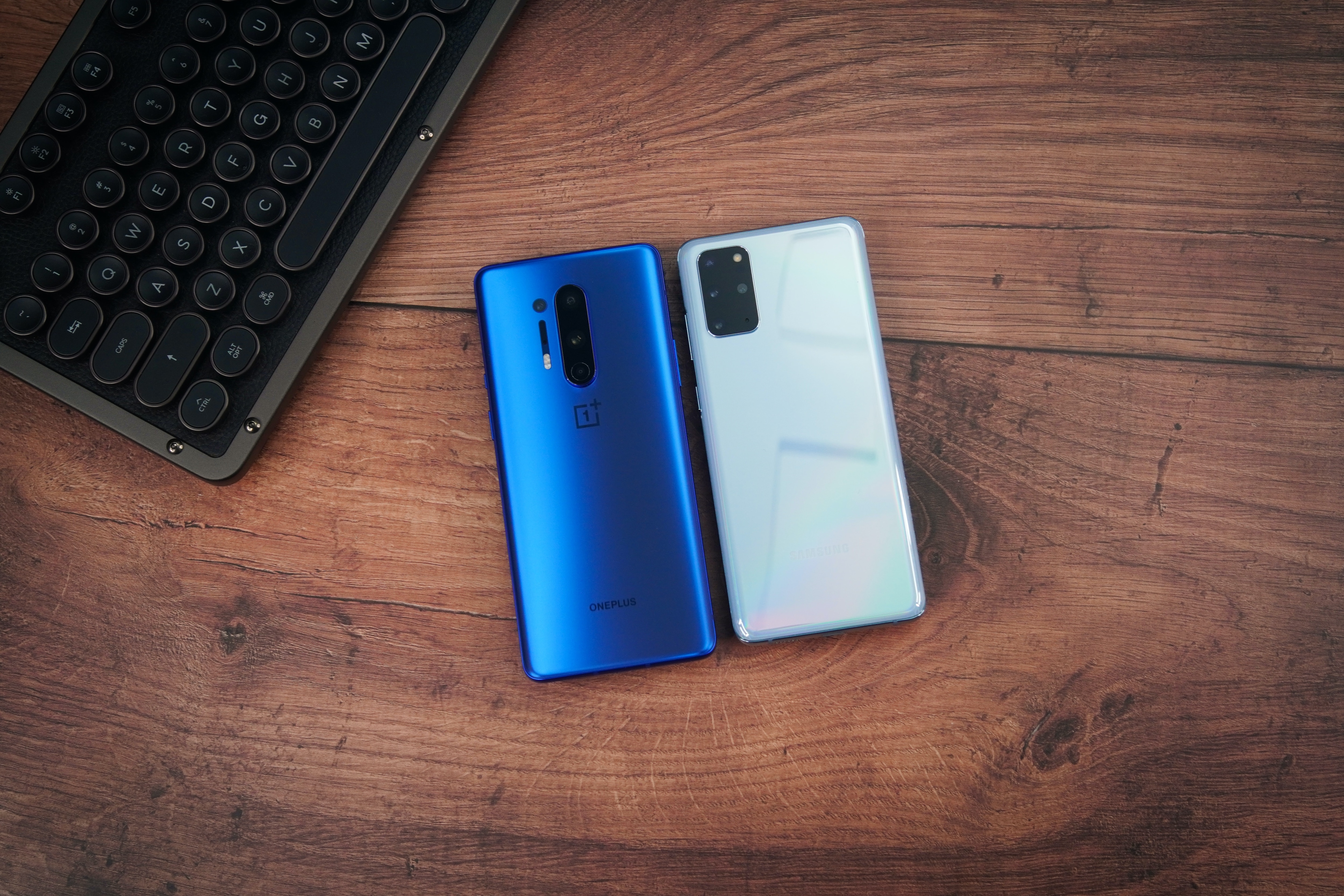 two android phones on a wooden table